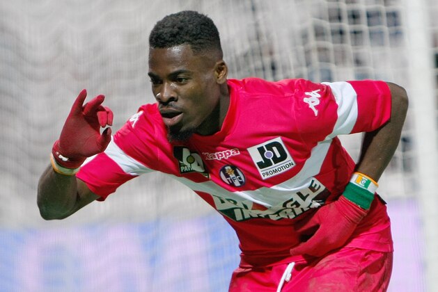 Toulouse's French defender Serge Aurier,  gestures after scoring against Marseille, during their League One soccer match, at the Velodrome Stadium, in Marseille, southern France, Sunday, Feb. 2, 2014. (AP Photo/Claude Paris)