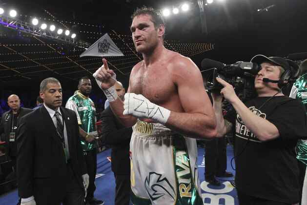 Tyson Fury gestures after a heavyweight boxing match against Steve Cunningham, Saturday, April 20, 2013 at the Theatre at Madison Square Garden in New York. Fury defeated Cunningham in a seventh round knock out.  (AP Photo/Mary Altaffer)