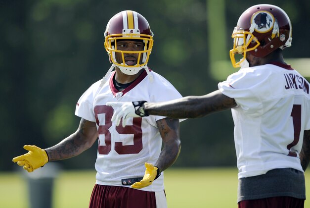 Washington Redskins wide receiver Santana Moss (89) talks with DeSean Jackson (1) during NFL football minicamp, Wednesday, June 18, 2014, in Ashburn, Va. (AP Photo/Nick Wass)