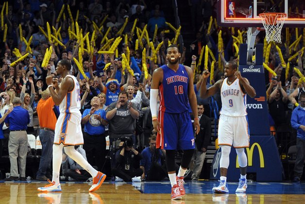 Apr 16, 2014; Oklahoma City, OK, USA;  Oklahoma City Thunder forward Kevin Durant (35) and Oklahoma City Thunder forward Serge Ibaka (9) celebrate after the Thunder beat the Detroit Pistons at Chesapeake Energy Arena. The Thunder defeated the Pistons 112-111. Mandatory Credit: Mark D. Smith-USA TODAY Sports