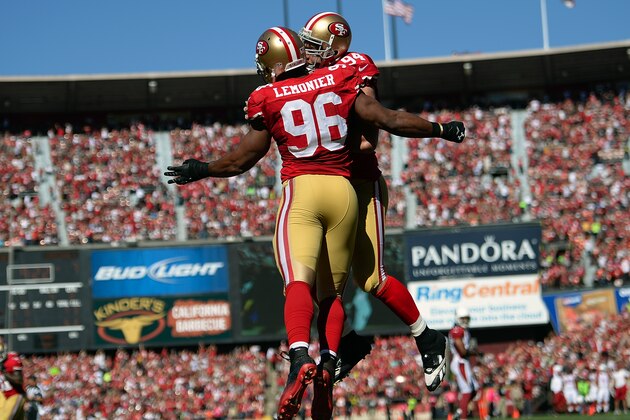 SAN FRANCISCO, CA - OCTOBER 13:  Corey Lemonier #96 and Justin Smith #94 of the San Francisco 49ers celebrates after Lemonier sacked quarterback Carson Palmer #3 of the Arizona Cardinals in the endzone for a safety during the second quarter at Candlestick Park on October 13, 2013 in San Francisco, California.  (Photo by Thearon W. Henderson/Getty Images)