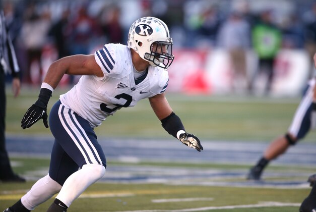 BYU's Kyle Van Noy competes in an NCAA college football game against Nevada, in Reno, Nev., on Saturday, Nov. 30, 2013. (AP Photo/Cathleen Allison)
