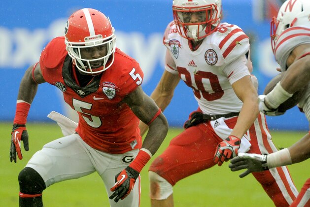 Georgia cornerback Damian Swann (5)drops back into coverage during the first half of the Gator Bowl NCAA college football game against Nebraska, Wednesday, Jan. 1, 2014, in Jacksonville, Fla. Nebraska beat Georgia 24-19. (AP Photo/Stephen B. Morton)
