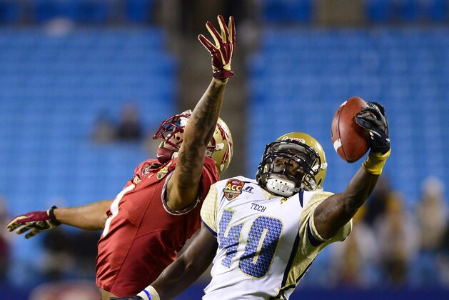 Dec 1, 2012; Charlotte, NC, USA; Georgia Tech Yellow Jackets defensive back Jemea Thomas (40) intercepts a pass in the fourth quarter intended for Florida State Seminoles wide receiver Kelvin Benjamin (1) in the ACC Championship game at Bank of America Stadium. Mandatory Credit: Bob Donnan-USA TODAY Sports