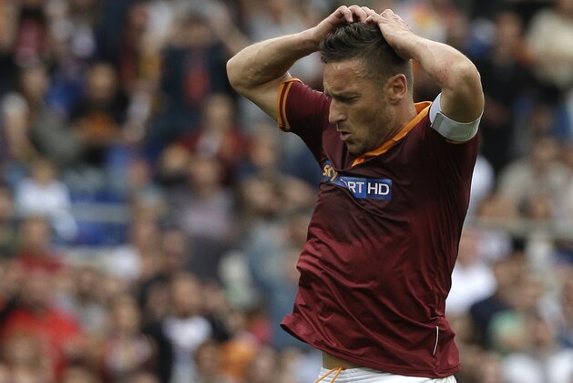 Roma forward Francesco Totti reacts after failing to score during an Italian Serie A soccer match between Roma and Juventus at Rome's Olympic stadium, Sunday, May 11, 2014. (AP Photo/Alessandra Tarantino)