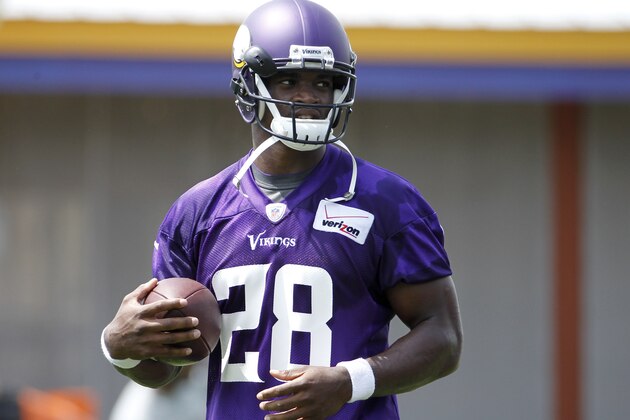 Minnesota Vikings running back Adrian Peterson (28) carries the ball during an NFL mini camp in Eden Prairie, Minn., Tuesday, June 17, 2014. (AP Photo/Ann Heisenfelt)