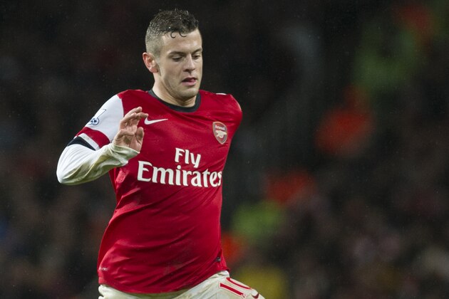 Arsenal's Jack Wilshere, controls the ball against Cardiff City, during their English Premier League match, at Emirates Stadium, in London, Wednesday, Jan. 1, 2014. (AP Photo/Bogdan Maran)