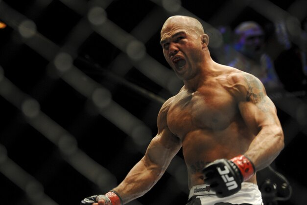 May 24, 2014; Las Vegas, NV, USA; Robbie Lawler (red) screams after finishing his UFC 173 light heavyweight bout against opponent Jake Ellenberger (blue) at MGM Grand Garden Arena. Lawler won his bout by way of TKO. Mandatory Credit: Stephen R. Sylvanie-USA TODAY Sports