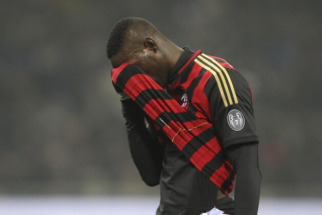 AC Milan forward Mario Balotelli reacts after missing a scoring chance during the Serie A soccer match between Inter Milan and AC Milan at the San Siro stadium in Milan, Italy, Sunday, Dec. 22, 2013. A late goal from Rodrigo Palacio gave Inter Milan a 1-0 win over city rival AC Milan in an entertaining derby match in Serie A on Sunday. Palacio struck four minutes from time to send three quarters of San Siro into a frenzy. (AP Photo/Antonio Calanni)