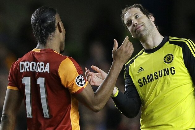 Galatasaray's Didier Drogba, left, greets Chelsea's Petr Cech at the end of the Champions League round of 16 second leg soccer match between Chelsea and Galatasaray at Stamford Bridge stadium  in London Tuesday, March 18, 2014. (AP Photo/Kirsty Wigglesworth)