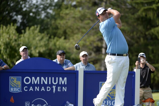 Jul 24, 2014; Ile Bizard, Quebec, CAN; Michael Putnam tees off on the  the 9th hole during the first round of the RBC Canadian Open at Royal Montreal GC - Blue Course. Mandatory Credit: Eric Bolte-USA TODAY Sports