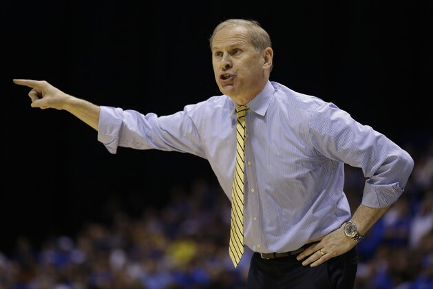 Michigan head coach John Beilein gestures during the first half of an NCAA Midwest Regional final college basketball tournament game against Kentucky Sunday, March 30, 2014, in Indianapolis. (AP Photo/Michael Conroy)