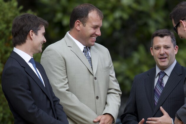 NASCAR Sprint Cup Series champion Tony Stewart , third from left, talks with, from left, Jeff Gordon, Ryan Newman, and Kyle Busch after an event with President Barack Obama to honor his championship, and the other 2011 Sprint Cup Series drivers at the White House on Tuesday, April 17, 2012 in Washington.  (AP Photo/Evan Vucci)