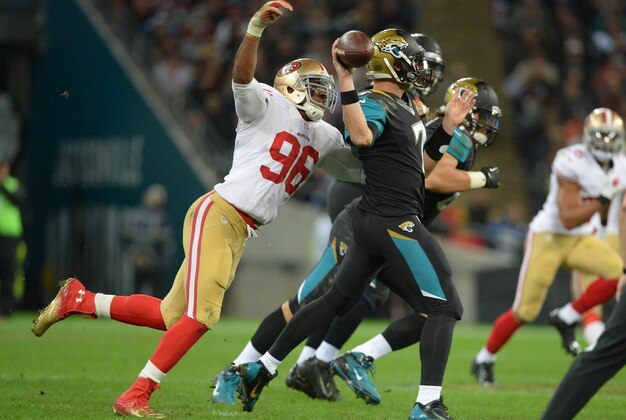 Oct 27, 2013; London, UNITED KINGDOM; Jacksonville Jaguars quarterback Chad Henne (7) is pressured by San Francisco 49ers linebacker Corey Lemonier (96)  during an International Series game at Wembley Stadium. Mandatory Credit: Bob Martin-USA TODAY Sports
