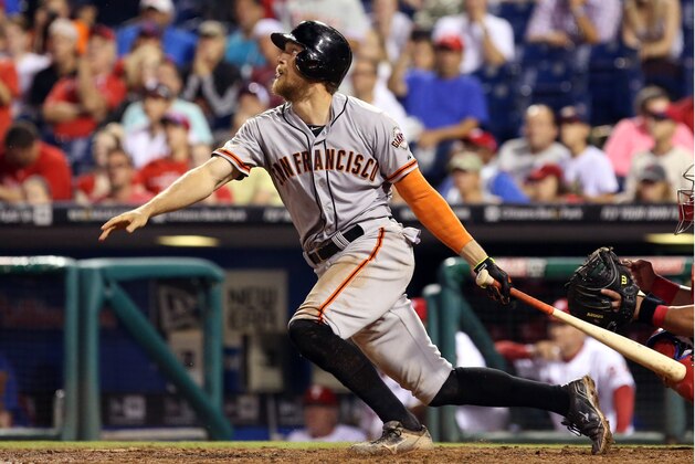 Jul 23, 2014; Philadelphia, PA, USA; San Francisco Giants right fielder Hunter Pence (8) hits a three RBI double in the ninth inning of a game against the Philadelphia Phillies at Citizens Bank Park. The Giants won 3-1. Mandatory Credit: Bill Streicher-USA TODAY Sports