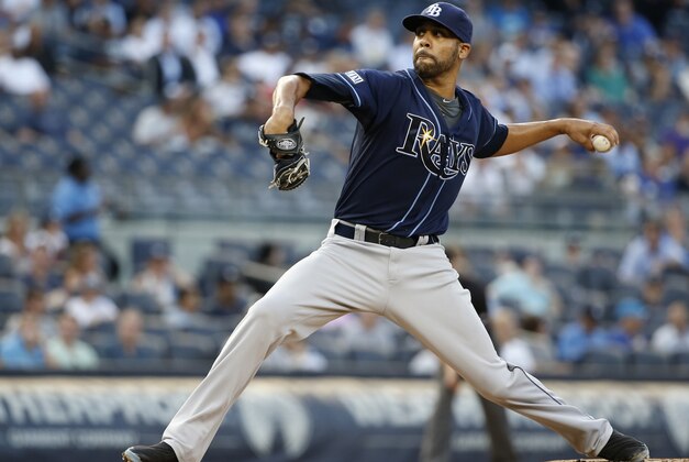 Tampa Bay Rays starting pitcher David Price delivers in the third inning of a baseball game against the New York Yankees at Yankee Stadium in New York, Tuesday, July 1, 2014.  (AP Photo/Kathy Willens)