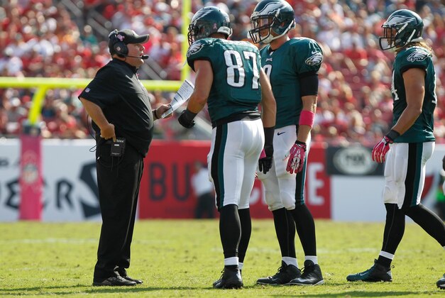 Oct 13, 2013; Tampa, FL, USA; Philadelphia Eagles head coach Chip Kelly talks with tight end Brent Celek (87) and quarterback Nick Foles (9) against the Tampa Bay Buccaneers  during the second half at Raymond James Stadium. Philadelphia Eagles defeated the Tampa Bay Buccaneers 31-20. Mandatory Credit: Kim Klement-USA TODAY Sports