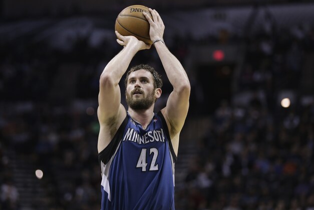 Minnesota Timberwolves' Kevin Love shoots a free throw against the San Antonio Spurs during the second half on an NBA basketball game, Friday, Dec. 13, 2013, in San Antonio.  San Antonio won 117-110. (AP Photo/Eric Gay)