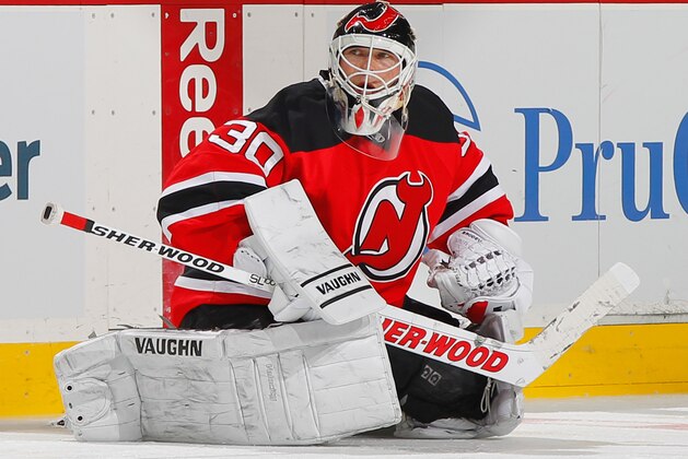 NEWARK, NJ - APRIL 13: Starting goaltender Martin Brodeur #30 of the New Jersey Devils stretches during pregame warmups prior to the final game of the 2013-2014 NHL season against the Boston Bruins at the Prudential Center on April 13, 2014 in Newark, New Jersey. (Photo by Andy Marlin/NHLI via Getty Images)