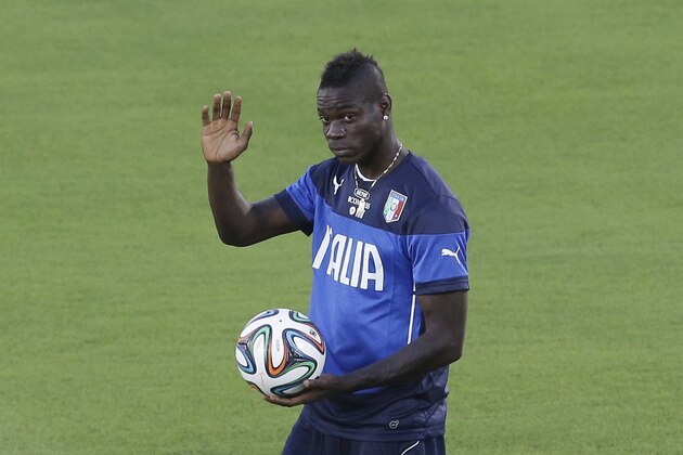 Italy's Mario Balotelli waves prior to a training session of Italy in Natal, Brazil, Saturday, June 21, 2014. Italy plays in group D of the 2014 soccer World Cup. Italy proved ineffective in a 1-0 loss to Costa Rica on Friday and now the Azzurri need a win or a draw against Uruguay on Tuesday to reach the second round. (AP Photo/Antonio Calanni)
