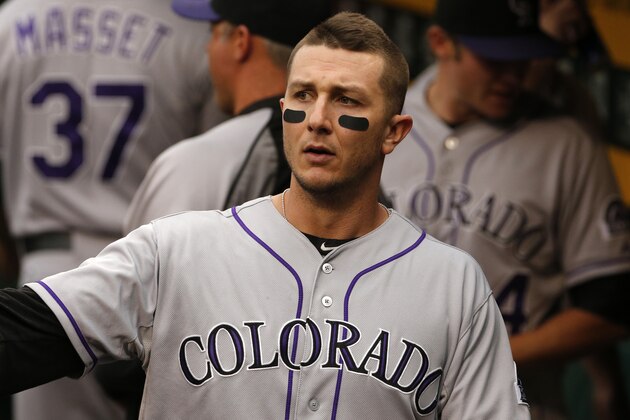 Colorado Rockies' Troy Tulowitzki walks in the dugout during a baseball game against the Pittsburgh Pirates in Pittsburgh Friday, July 18, 2014. The Pirates won 4-2. (AP Photo/Gene J. Puskar)