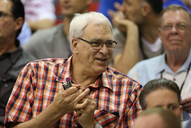 New York Knicks president Phil Jackson watches his team play the Dallas Mavericks in an NBA summer league basketball game Friday, July 11, 2014, in Las Vegas. (AP Photo/John Locher)