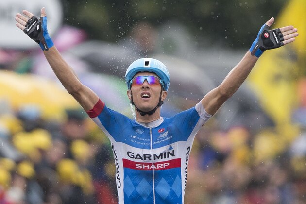 Lithuania's Ramunas Navardauskas crosses the finish line to win the nineteenth stage of the Tour de France cycling race over 208.5 kilometers (129.6 miles) with start in Maubourguet and finish in Bergerac, France, Friday, July 25, 2014. (AP Photo/Peter Dejong)