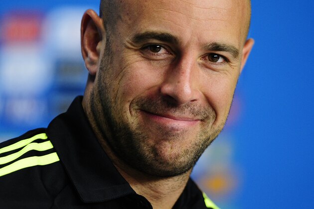 Spain's goalkeeper Pepe Reina smiles during an official press conference the day before the group B World Cup soccer match between Spain and Australia at the Arena da Baixada stadium in Curitiba, Brazil, Sunday, June 22, 2014. Spain will play in group B of the Brazil 2014 World Cup. (AP Photo/Manu Fernandez)