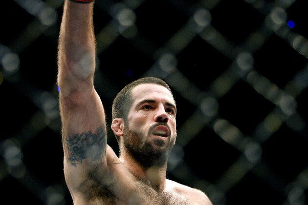 May 10, 2014; Cincinnati, OH, USA; Matt Brown (red gloves) fights Erick Silva (blue gloves) during a welterweight bout at US Bank Arena. Mandatory Credit: Joe Maiorana-USA TODAY Sports