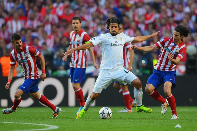 LISBON, PORTUGAL - MAY 24:  Sami Khedira of Real Madrid and Tiago of Club Atletico de Madrid battle for the ball uring the UEFA Champions League Final between Real Madrid and Atletico de Madrid at Estadio da Luz on May 24, 2014 in Lisbon, Portugal.  (Photo by Michael Regan/Getty Images)