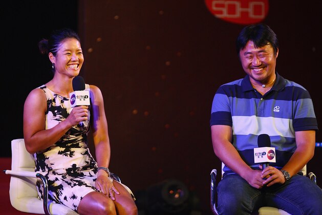 BEIJING, CHINA - JULY 05:  French Open champion Li Na (left) and her husband Jiang Shan (right) attend a celebration event with her fans organized by Women Tennis Association (WTA) on July 5, 2011 in Beijing, China.  (Photo by Feng Li/Getty Images)