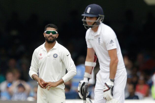 India spinner Ravindra Jadeja, left, looks in the direction of England's James Anderson as he waits to bowl on the fifth day of the second cricket test match between England and India at Lord's cricket ground in London, Monday, July 21, 2014. (AP Photo/Matt Dunham) India spinner Ravindra Jadeja, left, looks in the direction of England's James Anderson as he waits to bowl on the fifth day of the second cricket test match between England and India at Lord's cricket ground in London, Monday, July 21, 2014. (AP Photo/Matt Dunham)