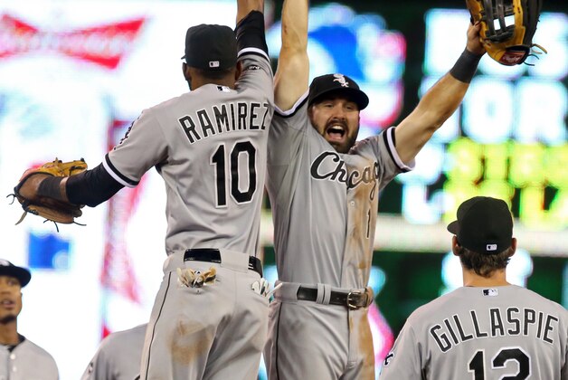 Chicago White Sox' Adam Eaton, right, and Alexei Ramirez celebrate after the White Sox beat the Minnesota Twins 5-2 in a baseball game, Thursday, July 24, 2014, in Minneapolis. Eaton went 3-for-5 with two RBI's. (AP Photo/Jim Mone)