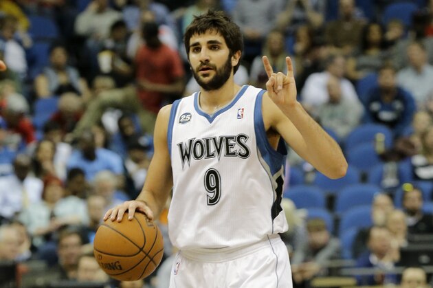 Minnesota Timberwolves guard Ricky Rubio (9), of Spain, gestures to teammates during the fourth quarter of an NBA basketball game against the Chicago Bulls in Minneapolis, Wednesday, April 9, 2014. The Bulls won 102-87. (AP Photo/Ann Heisenfelt)