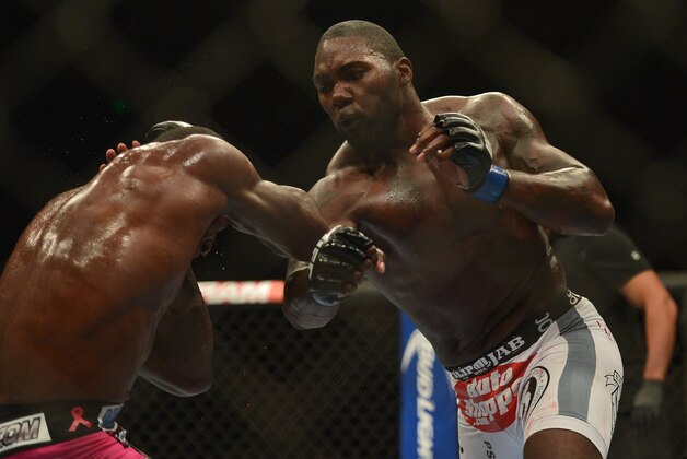 Apr 26, 2014; Baltimore, MD, USA; Anthony Johnson (right) strikes Phil Davis during their fight at Baltimore Arena. Johnson defeated Davis by judges decision. Mandatory Credit: Tommy Gilligan-USA TODAY Sports Apr 26, 2014; Baltimore, MD, USA; Anthony Johnson (right) strikes Phil Davis during their fight at Baltimore Arena. Johnson defeated Davis by judges decision. Mandatory Credit: Tommy Gilligan-USA TODAY Sports