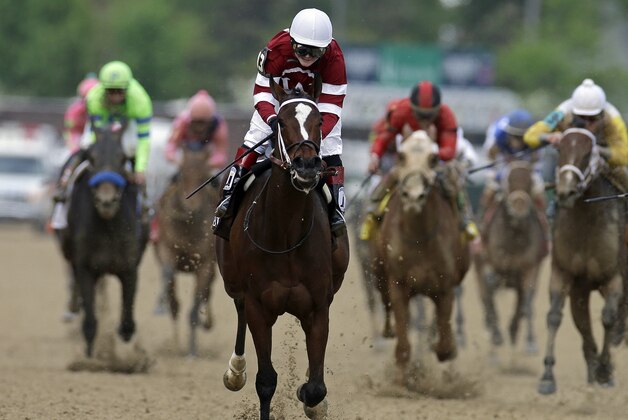 Rosie Napravnik rides Untapable to victory during the 140th running of the Kentucky Oaks horse race at Churchill Downs Friday, May 2, 2014, in Louisville, Ky. (AP Photo/Darron Cummings)
