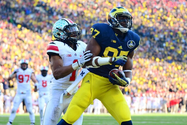 Nov 30, 2013; Ann Arbor, MI, USA; Michigan Wolverines tight end Devin Funchess (87) catches a pass in the end zone for a touchdown while being defended by Ohio State Buckeyes cornerback Bradley Roby (1) during the fourth quarter at Michigan Stadium. Mandatory Credit: Andrew Weber-USA TODAY Sports Nov 30, 2013; Ann Arbor, MI, USA; Michigan Wolverines tight end Devin Funchess (87) catches a pass in the end zone for a touchdown while being defended by Ohio State Buckeyes cornerback Bradley Roby (1) during the fourth quarter at Michigan Stadium. Mandatory Credit: Andrew Weber-USA TODAY Sports