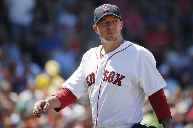 Boston Red Sox's Jake Peavy walks to the dug out after pitching in the fourth inning of a baseball game against the Baltimore Orioles in Boston, Sunday, July 6, 2014. (AP Photo/Michael Dwyer)