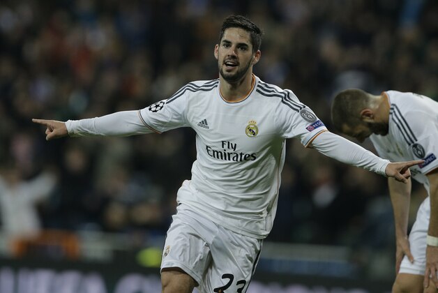 Real's Isco celebrates scoring his side's first goal during a Champions League quarterfinal first leg soccer match between Real Madrid and Borussia Dortmund at the Santiago Bernabeu stadium in Madrid, Spain, Wednesday April 2, 2014. (AP Photo/Paul White)