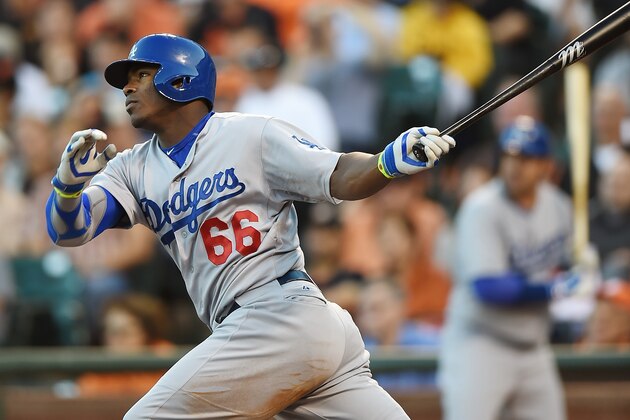 SAN FRANCISCO, CA - JULY 25:  Yasiel Puig #66 of the Los Angeles Dodgers hits a double in the top of the third inning against the San Francisco Giants at AT&T Park on July 25, 2014 in San Francisco, California.  (Photo by Thearon W. Henderson/Getty Images)
