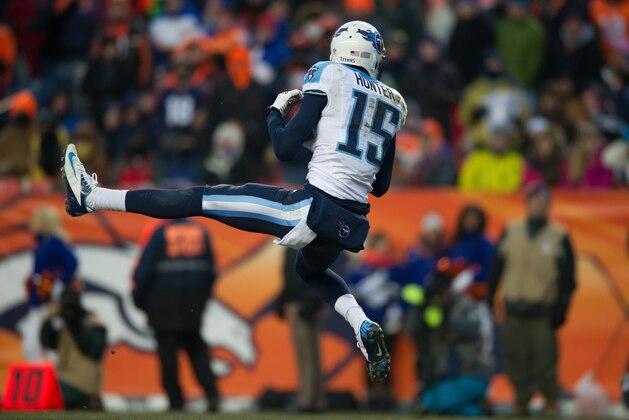 DENVER, CO - DECEMBER 8:  Wide receiver Justin Hunter #15 of the Tennessee Titans catches a 41-yard touchdown pass in the third quarter of a game against the Denver Broncos at Sports Authority Field Field at Mile High on December 8, 2013 in Denver, Colorado.  (Photo by Dustin Bradford/Getty Images)