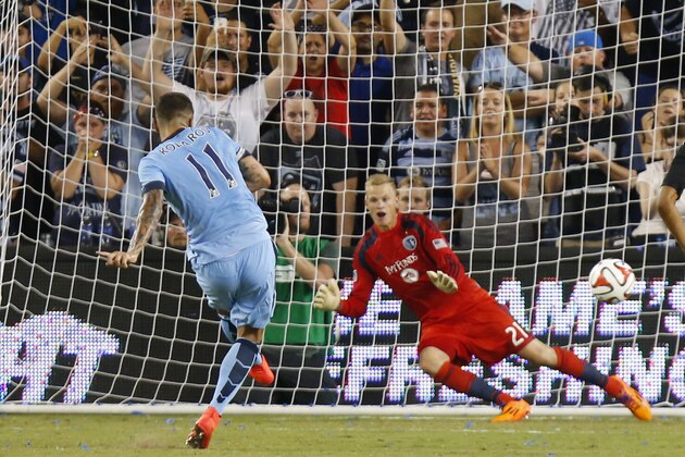 KANSAS CITY, KS - JULY 23: Dedryck Boyata #11 of Manchester City scores a goal past Jon Kempin #21 of Sporting KC during a penalty kick early in the second half on July 23rd at Sporting Park in Kansas City, Kansas. (Photo by Kyle Rivas/Getty Images)