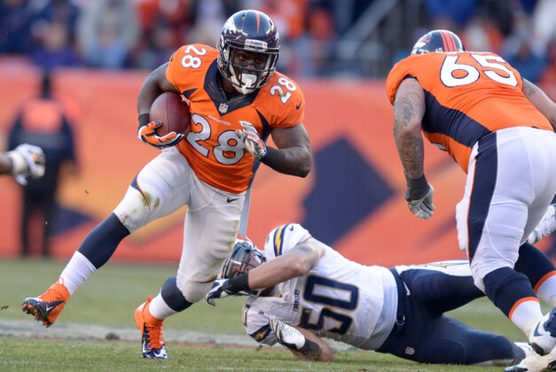 Jan 12, 2014; Denver, CO, USA; Denver Broncos running back Montee Ball (28) attempts to elude San Diego Chargers linebacker Manti Te'o (50) during the 2013 AFC divisional playoff football game at Sports Authority Field at Mile High. Mandatory Credit: Kirby Lee-USA TODAY Sports