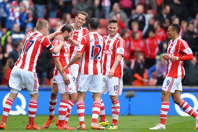 STOKE ON TRENT, ENGLAND - APRIL 12: Erik Pieters of Stoke City is mobbed after scoring a first half goal during the Barclays Premier League match between Stoke City and Newcastle United at Britannia Stadium on April 12, 2014 in Stoke on Trent, England.  (Photo by Laurence Griffiths/Getty Images)