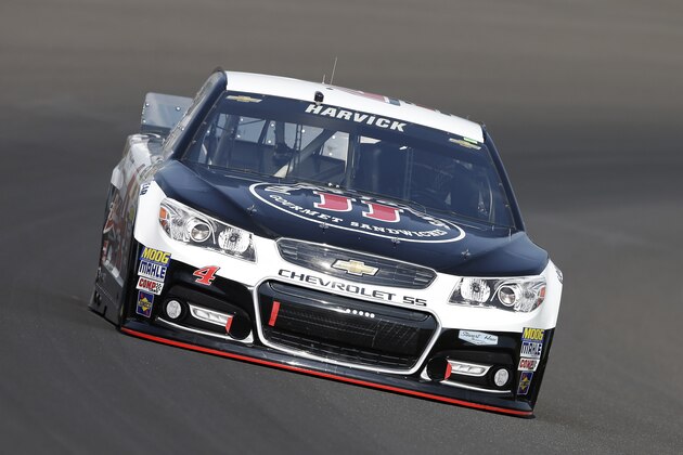 Kevin Harvick drives through turn one during practice for the Brickyard 400 Sprint Cup series auto race at the Indianapolis Motor Speedway in Indianapolis, Saturday, July 26, 2014. (AP Photo/Darron Cummings)