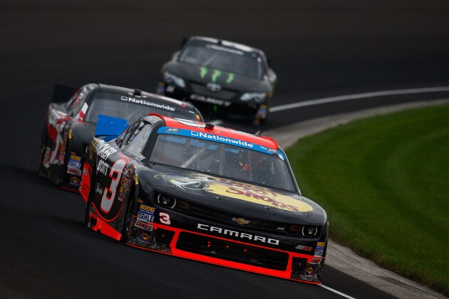 INDIANAPOLIS, IN - JULY 26:  Ty Dillon, driver of the #3 Bass Pro Shops Chevrolet, leads Kevin Harvick, driver of the #5 Morton Buildings Chevrolet, and Kyle Busch, driver of the #54 Monster Energy Toyota, during the NASCAR Nationwide Series Lilly Diabetes 250 at Indianapolis Motor Speedway on July 26, 2014 in Indianapolis, Indiana.  (Photo by Chris Trotman/Getty Images)