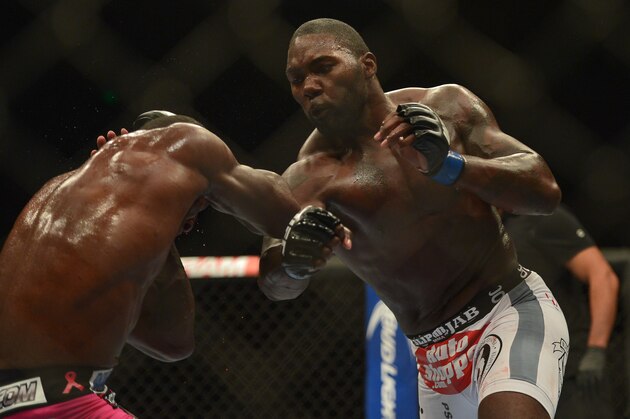 Apr 26, 2014; Baltimore, MD, USA; Anthony Johnson (right) strikes Phil Davis during their fight at Baltimore Arena. Johnson defeated Davis by judges decision. Mandatory Credit: Tommy Gilligan-USA TODAY Sports
