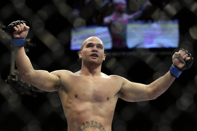 Robbie Lawler celebrates his victory over Rory MacDonald, of Canada, following a UFC 167 mixed martial arts welterweight bout on Saturday, Nov. 16, 2013, in Las Vegas. Lawler won by split decision. (AP Photo/Isaac Brekken)