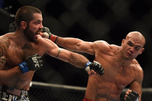July 26, 2014; San Jose, CA, USA; Robbie Lawler (red gloves) punches Matt Brown (blue gloves) during the welterweight bout of the FOX UFC Saturday at SAP Center. Mandatory Credit: Kyle Terada-USA TODAY Sports