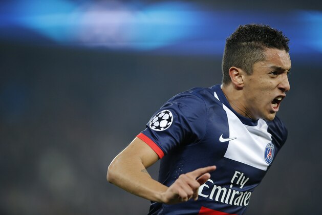 PSG's Marquinhos celebrates his side's first goal during a Champions League last 16 second leg soccer match between Paris Saint Germain against Bayer Leverkusen at Parc des Princes stadium in Paris, Wednesday, March 12, 2014. (AP Photo/Michel Euler)